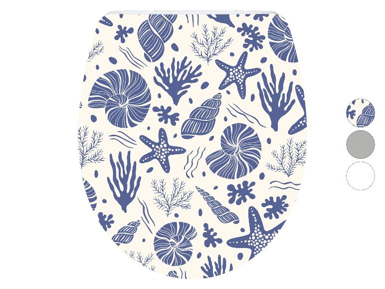 Abattant de toilettes avec motif de coquillages, coraux et étoiles de mer.