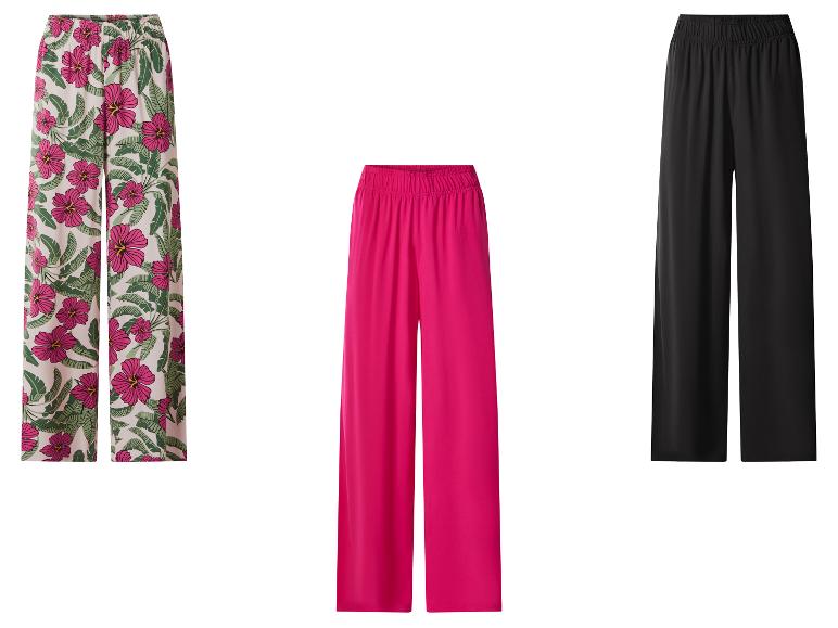 Drie wijde broeken: bloemenprint, fuchsia en zwart.