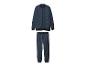 Donkerblauw trainingspak met ritsjack en bijpassende joggingbroek.