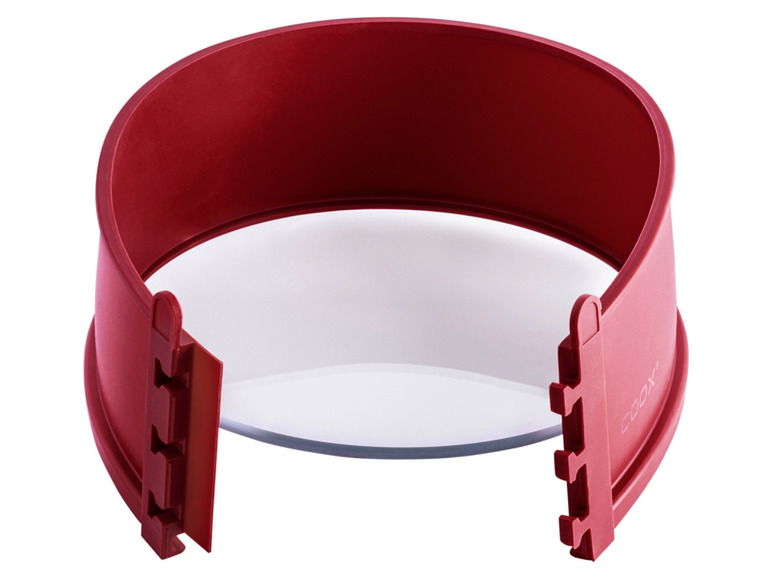 Un moule à gâteau rouge et ajustable de Coox.