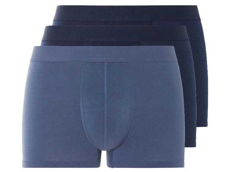 Drie blauwe boxershorts.
