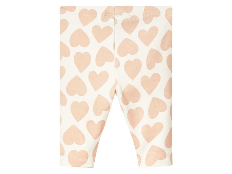 Witte leggings met roze hartjesprint.