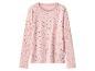 T-shirt rose à manches longues avec des pois foncés.