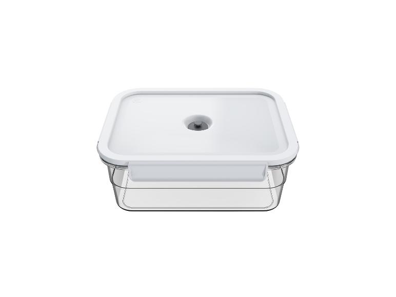 Récipient sous vide transparent avec couvercle blanc pour la conservation des aliments.