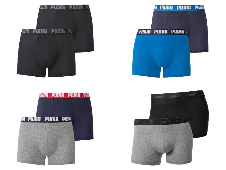 Lot de boxers pour hommes en quatre couleurs : noir, bleu, bleu marine et gris.
