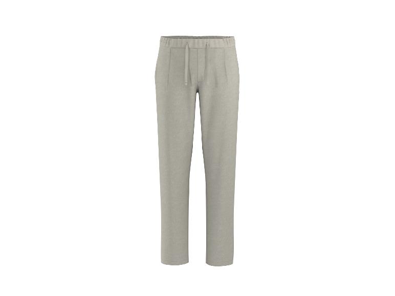 Pantalon de survêtement beige clair avec cordon de serrage à la taille.