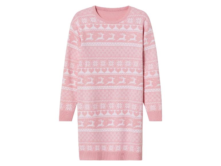 Un pull de Noël rose avec des rennes et des flocons de neige.