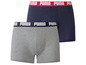 Deux paires de boxers Puma en gris et bleu foncé.