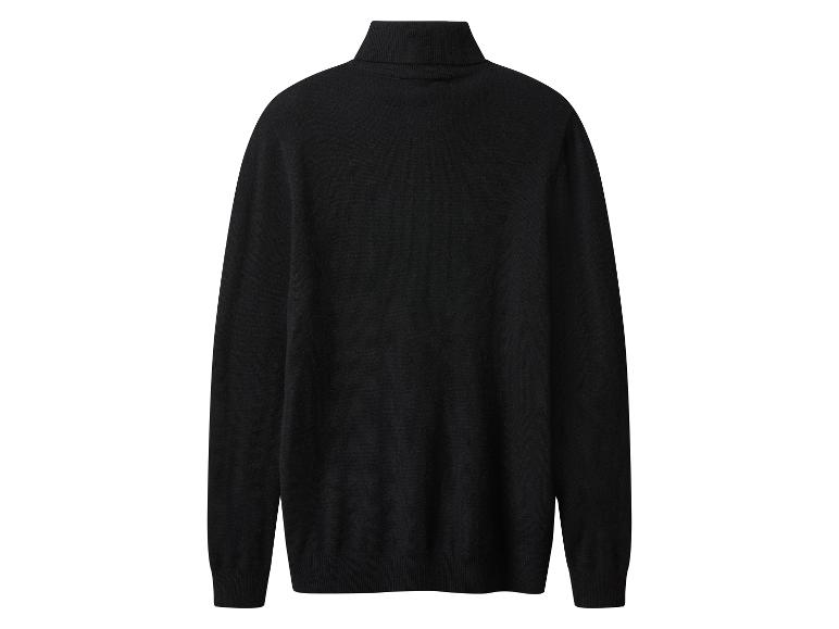 Pull noir à col roulé, en maille fine.