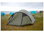 Een groene Grand Canyon tent op een grasveld met andere tenten op de achtergrond.