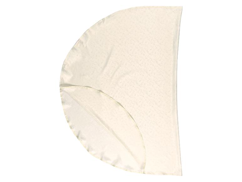 Crèmekleurig tafelkleed met bloemenpatroon, in vieren gevouwen