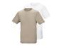 Twee T-shirts met korte mouwen, één beige en één wit, op elkaar gestapeld.
