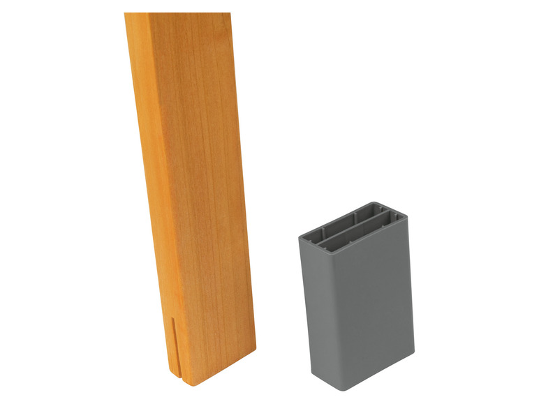 Een houten tafelpoot met een grijze beschermkap.