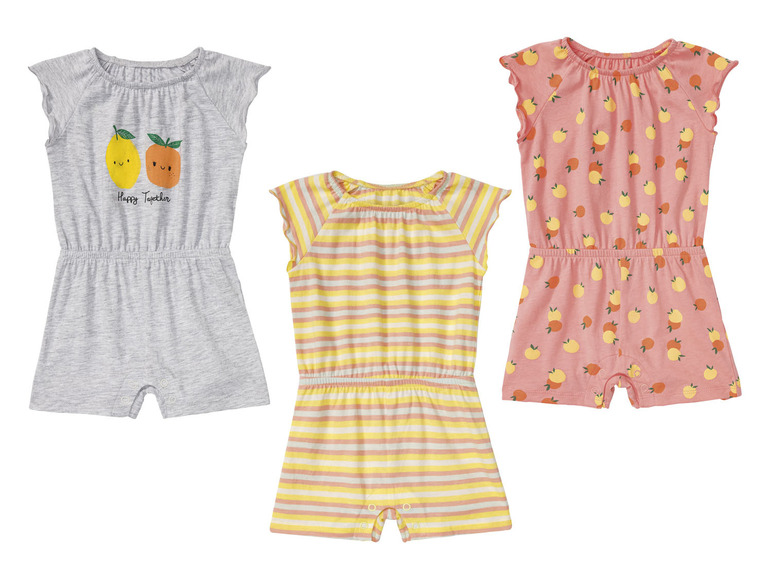 Trois barboteuses bébé à manches courtes: une grise avec des citrons, une rayée et une rose avec des oranges.