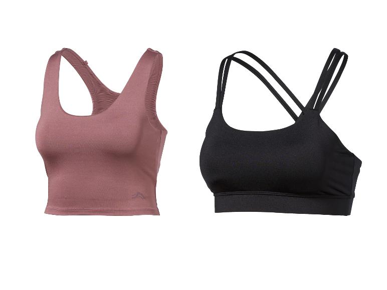 Deux soutiens-gorge de sport, un rose-brun et un noir, sur fond blanc.