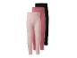 Trois leggings pour filles : un rose à pois, un rose uni et un noir uni.