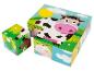 Houten puzzel met afbeeldingen van een koe, schaap, kikker en hert.