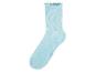 Chaussette côtelée bleu clair avec bord volanté.