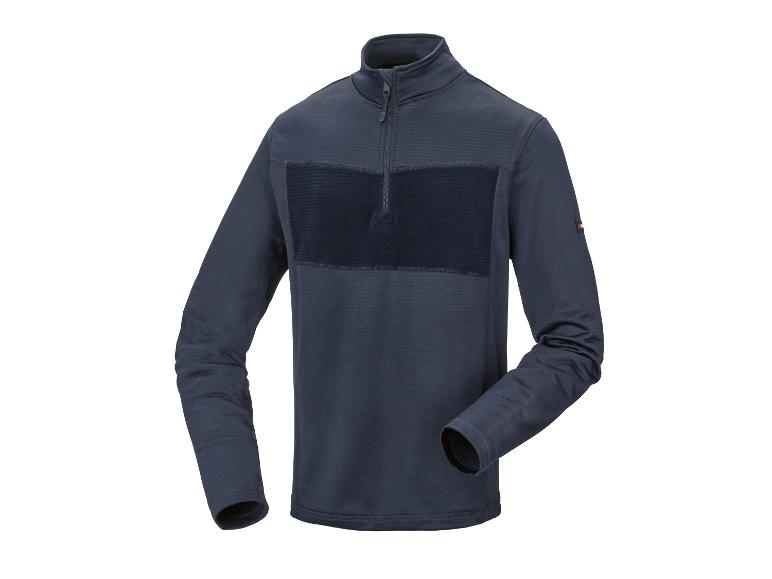 Donkerblauw shirt met lange mouwen, rits bij de hals en getextureerde panelen.