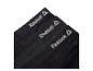 Trois boxers noirs Reebok avec logo visible.
