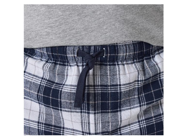 Blauwe en witte geruite pyjamabroek met elastiek en koord.