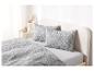 Beddengoed met grijs en wit paisley-patroon