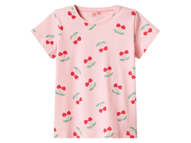 T-shirt rose à manches courtes avec un motif de cerises rouges.