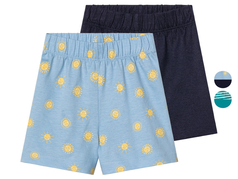 Deux paires de shorts pour garçon, l'un avec un imprimé soleil et l'autre bleu marine uni