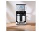 Cafetière SilverCrest en acier inoxydable avec affichage numérique sur une table en bois.