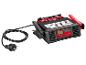 Chargeur de batterie de voiture noir avec câbles rouges et noirs.