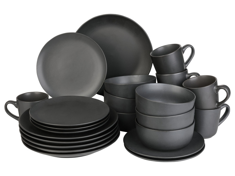 Un ensemble de vaisselle noire comprenant des assiettes, des bols et des tasses.