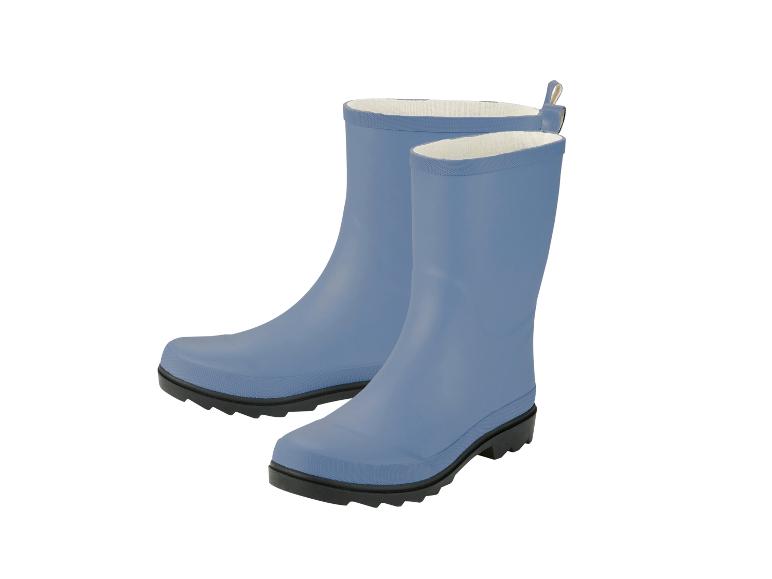 Une paire de bottes de pluie bleues avec semelles noires et intérieur blanc