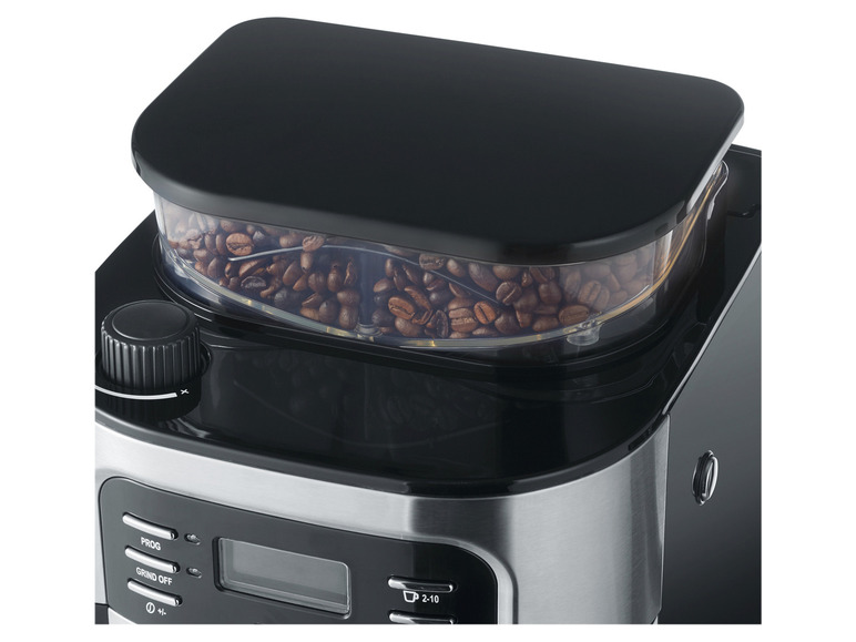 Une cafetière noire avec un réservoir transparent pour les grains de café.