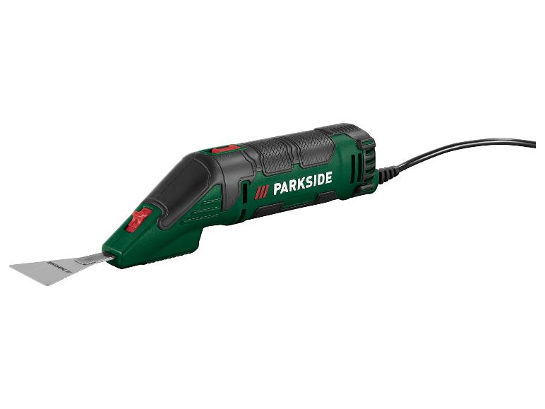 Een groen en zwart elektrisch gereedschap met een metalen blad en een zwarte kabel.