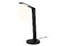 Lampe de bureau LED noire avec chargeur sans fil, émettant une lumière vive.