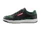 Zwart-groene Parkside sneakers met witte zolen.