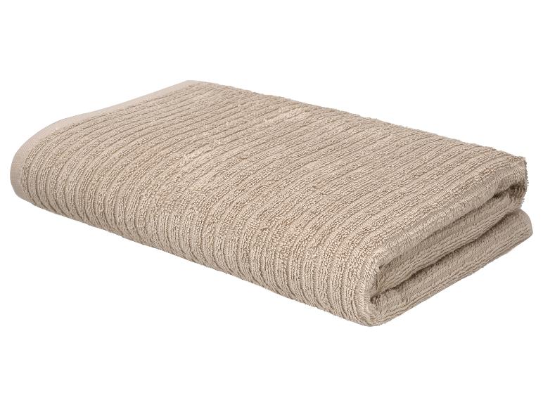 Gevouwen beige geribbelde handdoek