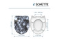 Toiletzitting met een abstract cirkelpatroon en een witte, gewone toiletzitting.