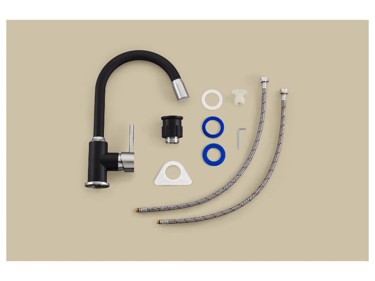 Robinet de cuisine noir et pièces d'installation sur fond beige.