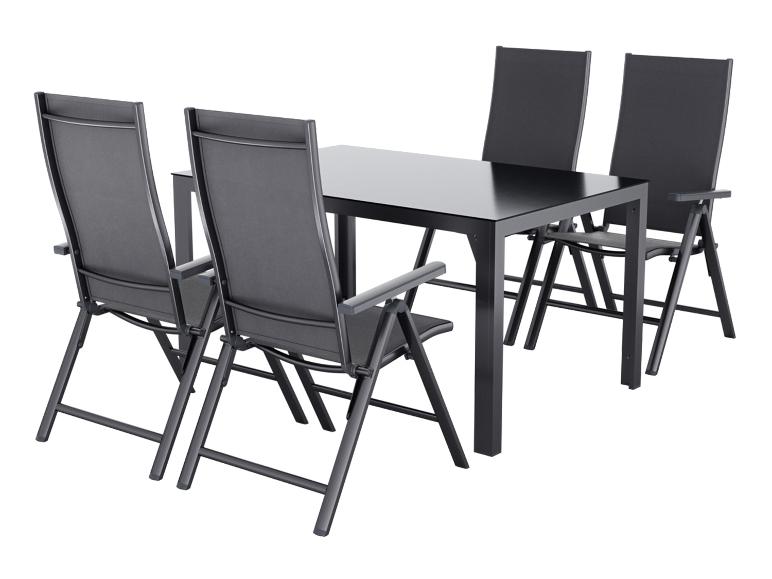 Ensemble de mobilier de jardin avec table noire et quatre chaises.