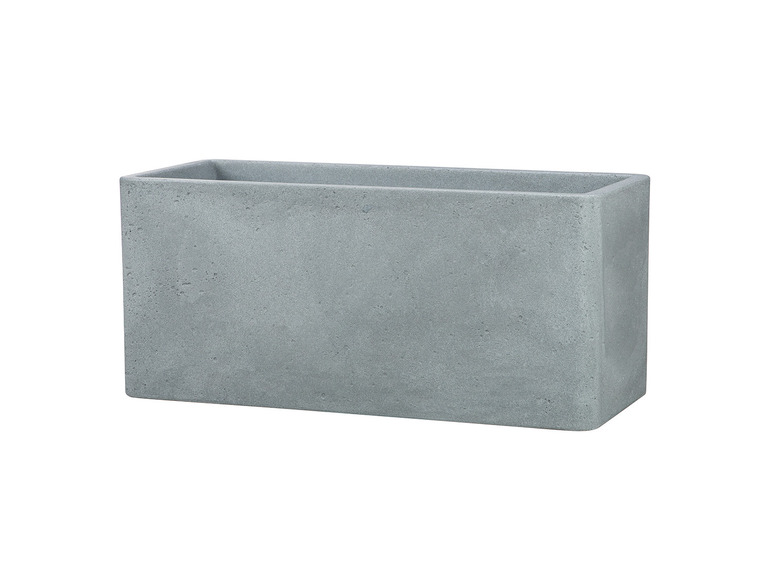 Un pot de fleurs rectangulaire en béton.