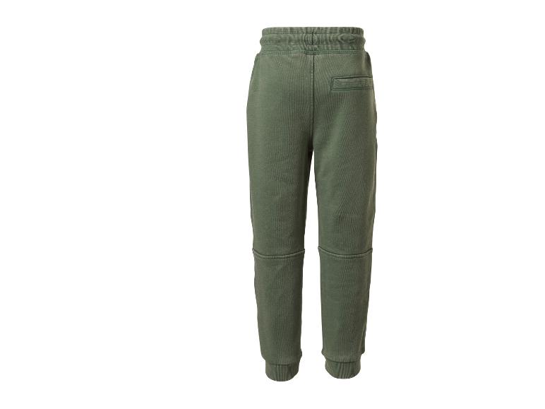 Pantalon de survêtement vert avec poche arrière et détails de couture.