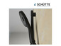 Une pomme de douche noire et une barre de douche de la marque Schütte.