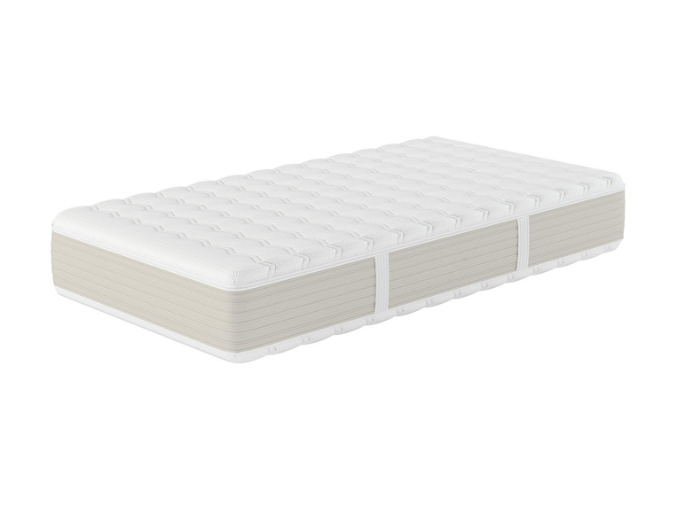 Un matelas blanc avec une partie inférieure beige.