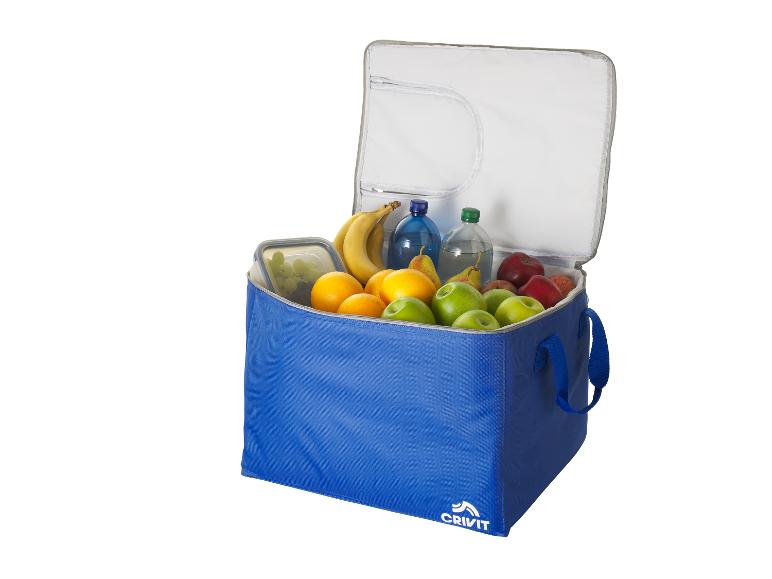 Sac isotherme bleu rempli de fruits et de bouteilles d'eau