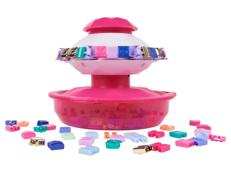 Un ensemble rose pour créer des bracelets avec des maillons colorés.