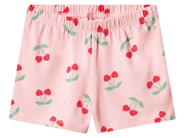 Short rose avec taille élastique et imprimé cerises.