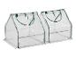 Twee transparante tuinkassen met groen frame