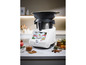 Een witte multicooker met een touchscreen en een glazen deksel