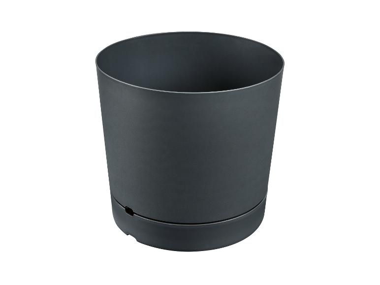 Pot de jardin rond gris foncé avec système de drainage à la base.